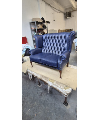 Wingback armchair in navy upholstery