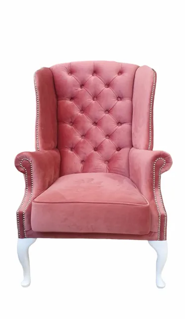 Öronlappsfåtölj i rosa velour på vita ben